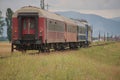 Romanian CFR old commuter train with red passenger cars Royalty Free Stock Photo