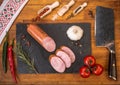 Cold platter of traditional sausage on wooden table