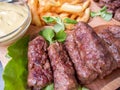 Romanian traditional food meat rolls mici with fries and mustard Royalty Free Stock Photo