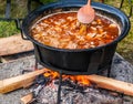 Romanian traditional food prepared at the cauldron on the open fire Royalty Free Stock Photo