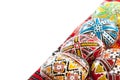 Romanian traditional hand decorated easter eggs on a traditional tablecloth with white copy space