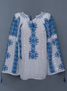 Romanian traditional manually embroidered blouse called ie traditionala romaneasca part of the national folk costume set. Traditio Royalty Free Stock Photo