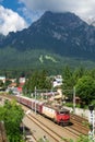 The Romanian train crossing the Prahova Valley in the Carpathian mountains, brings the tourists traveling Royalty Free Stock Photo