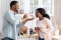 Romantic african american couple cooking healthy food together in kitchen Royalty Free Stock Photo