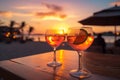 Romantic ambiance two cocktails, beach party blur, colorful sunset sky Royalty Free Stock Photo