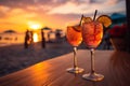 Romantic ambiance two cocktails, beach party blur, colorful sunset sky Royalty Free Stock Photo