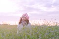 Romantic Asian beautiful girl walking in a field in sunset light. Winter, autumn life Royalty Free Stock Photo