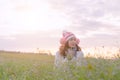 Romantic Asian beautiful girl walking in a field in sunset light. Winter, autumn life Royalty Free Stock Photo