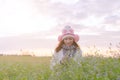 Romantic Asian beautiful girl walking in a field in sunset light. Winter, autumn life Royalty Free Stock Photo