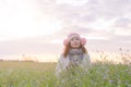 Romantic Asian beautiful girl walking in a field in sunset light. Winter, autumn life Royalty Free Stock Photo