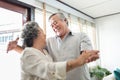 Romantic Asian Grandfather and Grandmother dancing together