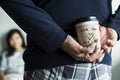 Romantic asian man brings a cup of coffee for wife Royalty Free Stock Photo