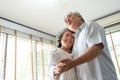 Romantic Asian Senior couple dancing at home. Happy Smiling Grandfather and Grandmother having fun Celebrating in wedding Royalty Free Stock Photo