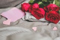 Romantic background with copy space. Beautiful roses and card with heart. Selective focus Royalty Free Stock Photo