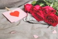 Romantic background with copy space. Beautiful roses and Valentine card with heart. Selective focus Royalty Free Stock Photo