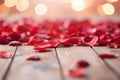 Romantic background for Valentine's Day, Wedding Day. Rose petals on a wooden floor, golden bokeh. Royalty Free Stock Photo