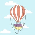 Balloon flight with a basket of flowers.