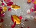 Romantic bath with white water and rose petals