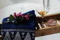 Romantic bath with white wine, towel, candle and flowers Royalty Free Stock Photo