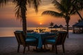 Romantic beach dinner with a breathtaking sunset sea view at a luxurious seaside resort Royalty Free Stock Photo