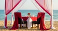 Romantic Beach Dinner Setup with Two Chairs and Ocean View romantic dinner table Royalty Free Stock Photo
