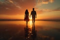 Romantic Beach: A serene beach scene with a couple walking hand in hand along the water. Royalty Free Stock Photo