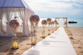 Romantic beachfront wedding ceremony white tent, flowers, candles, perfect for a honeymoon