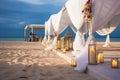 Romantic beachfront wedding ceremony white tent, flowers, candles, perfect for a honeymoon