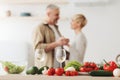 Romantic beautiful couple in modern cozy white kitchen room interior, celebrate holiday together at home Royalty Free Stock Photo