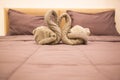 Romantic Bedroom Interior, Kissing Swan Origami Towels decoration on the hotel room bed for newlywed couple. Wedding, Valentine, Royalty Free Stock Photo
