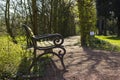 romantic bench in peaceful park in spring Royalty Free Stock Photo