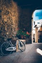 Romantic Bicycle with flowers in italian village Royalty Free Stock Photo