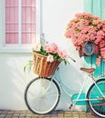 Romantic Bike with Colorful Wild Flower Basket Leaning on the Wall- Generated Artificial Intelligence -AI