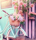 Romantic Bike with Colorful Wild Flower Basket Leaning on the Wall- Generated Artificial Intelligence -AI