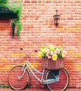 Romantic Bike with Colorful Wild Flower Basket Leaning on the Wall- Generated Artificial Intelligence -AI