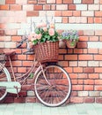 Romantic Bike with Colorful Wild Flower Basket Leaning on the Wall- Generated Artificial Intelligence -AI