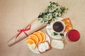 Romantic Birthday Breakfast.Cup of Coffee,Glass og red Beverage,Cut Orange,Biscuit with Cottage Cheese.Wish Card with Flowers.