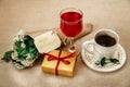 Romantic Birthday Breakfast.Cup of Coffee.Glass of Red Drink.Wish Card with Flowers.Present in Golden Box