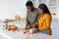Romantic Black Couple Cooking Together In Kitchen, Preparing Healthy Food At Home Royalty Free Stock Photo