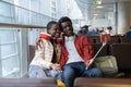 Romantic black couple take selfie in airport lounge before flight to vacation after end of corona Royalty Free Stock Photo