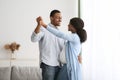 Romantic black pregnant couple dancing at home Royalty Free Stock Photo