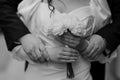 Romantic Black and White Wedding Embrace with Bouquet Royalty Free Stock Photo