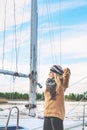 Romantic blonde standing next to boat mast Royalty Free Stock Photo