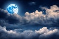 Romantic blue full moon in the night cloudy sky. Royalty Free Stock Photo
