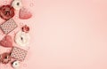 Romantic border of gifts, flowers and decorative hearts on pink background. St. Valentines Day concept Royalty Free Stock Photo