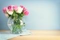 romantic bouquet of pink roses in the vase over wooden table Royalty Free Stock Photo