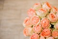 Romantic bouquet of roses apricot color close up on white background