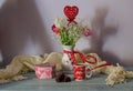 Romantic bouquet of tulips and box with a gift in the shape of heart, candies and a cup of coffee Royalty Free Stock Photo