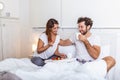 Romantic breakfast in bed man prepare for his woman, she was very happy, Young beautiful couple in bed having a breakfast and Royalty Free Stock Photo