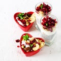 Romantic breakfast with chia, granola, yogurt and berries on old white concrete background. Health and diet concept. Royalty Free Stock Photo